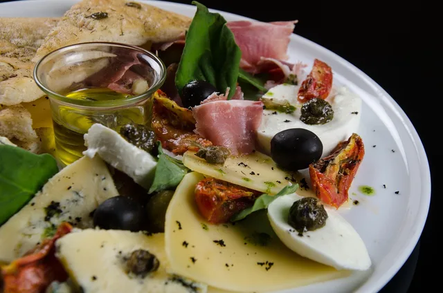 foccacia with olives, tasting, gourmet food, black olives, olive oil, plate, rosemary, tomato sauce, spices, tortilla, cheese, basil, tasting, black olives, olive oil, olive oil, olive oil, olive oil, olive oil. Food pairings that fill the gap alcohol leaves at an alcohol free bar