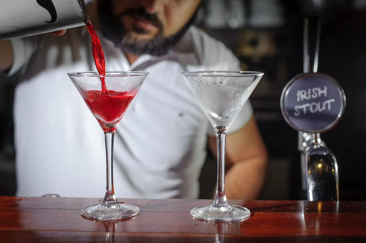 bartender, bar, glass, martini, juice, cocktail, shaker, pours, preparation, red, drink, table, bar counter, two, capacity, serving, bartender, bartender, bartender, bartender, bartender, martini. A small zero proof bar's juice program: what to settle first